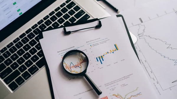A magnifying glass examining detailed charts, representing the scrutiny of AI retrieval and the narrowing funnel from search results to actual citations.